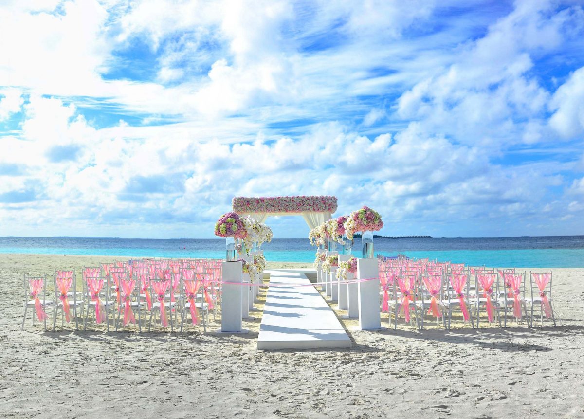 https://weddingdc.net/wp-content/uploads/2020/04/beach-chairs-clouds-colourful-169189-1200x861.jpg