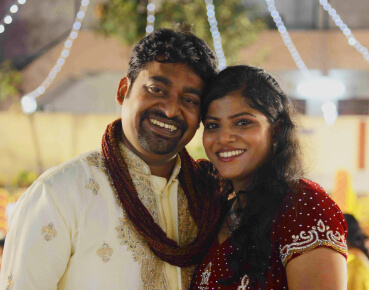 Mitu and Sherin smiling with wedding garlands at their wedding in Hyderabad, managed by our wedding planners