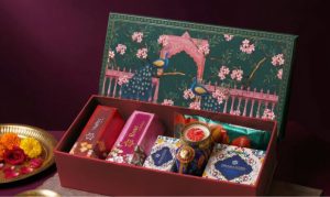 Festive wedding return gift box filled with sweets and treats