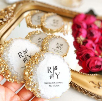 Personalised monogrammed wedding return gifts with gold borders